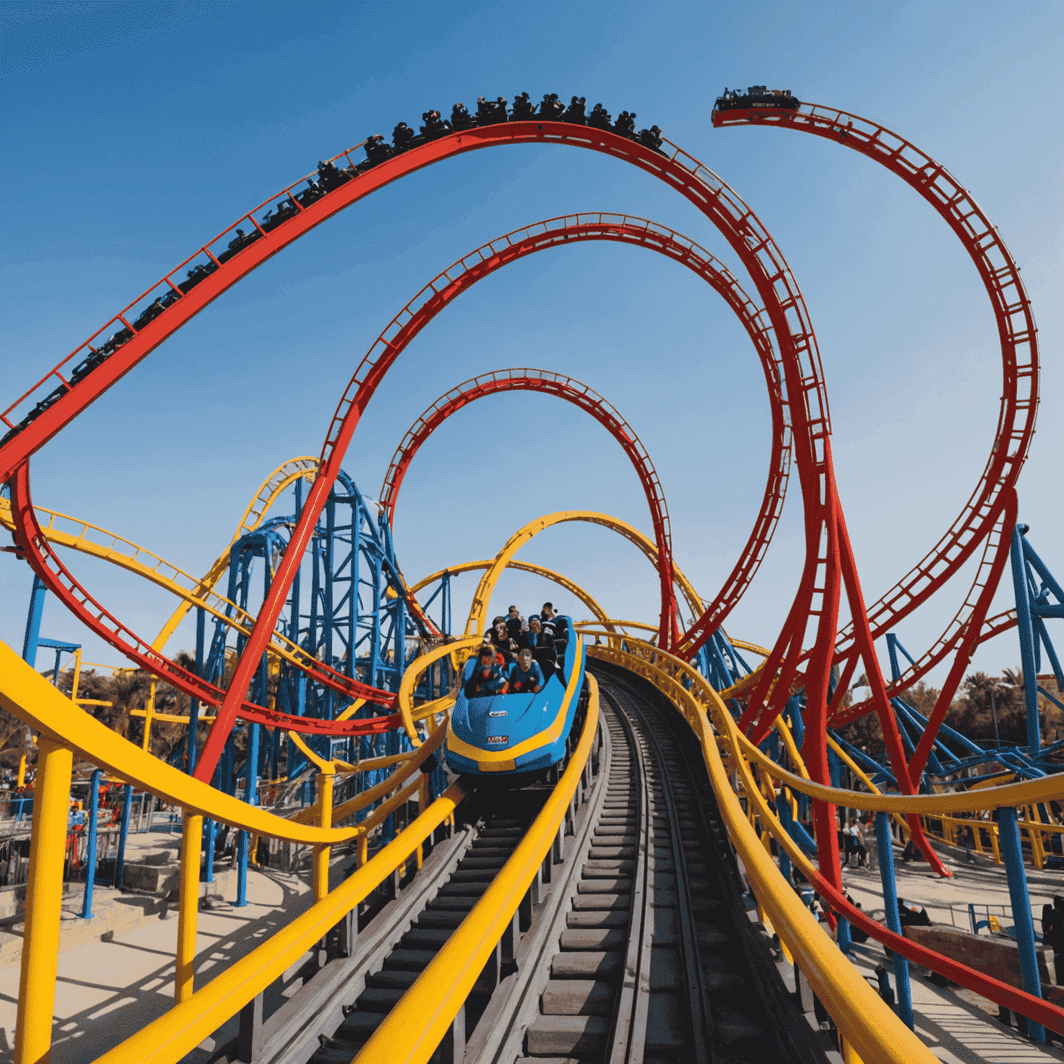 A high-speed roller coaster with loops and twists, showcasing the excitement of Thrill Rides at IMG Worlds of Adventure